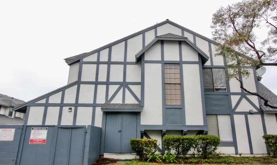 THIS IMAGE SHOWS THE FRONT OF THE HOUSE WITH SMALL PLANTS LOCATED IN ANAHEIM CITY