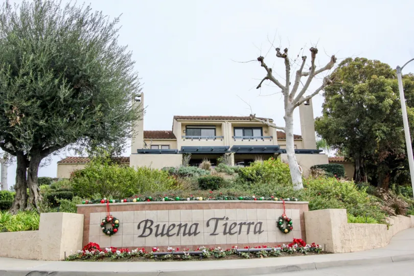 THIS IMAGE SHOWS THE HOUSE ON THE FRONT MANY PLANTS TREES NAME BOARD ARE THERE IN BUENA PARK