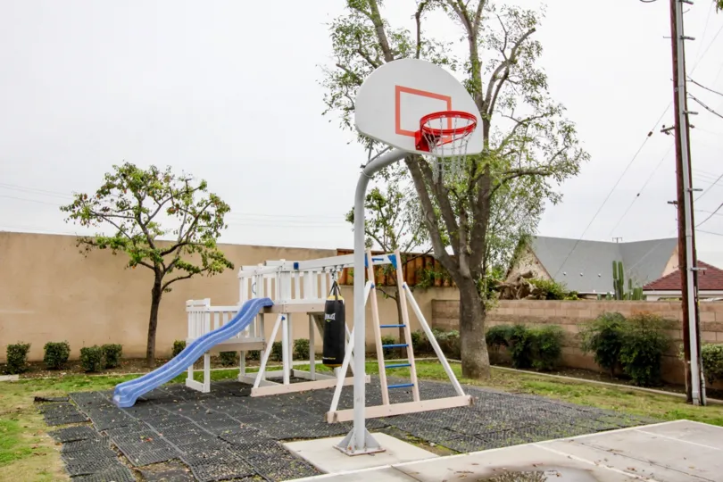A park in the Buena Villa Townhomes with a basket ball court.