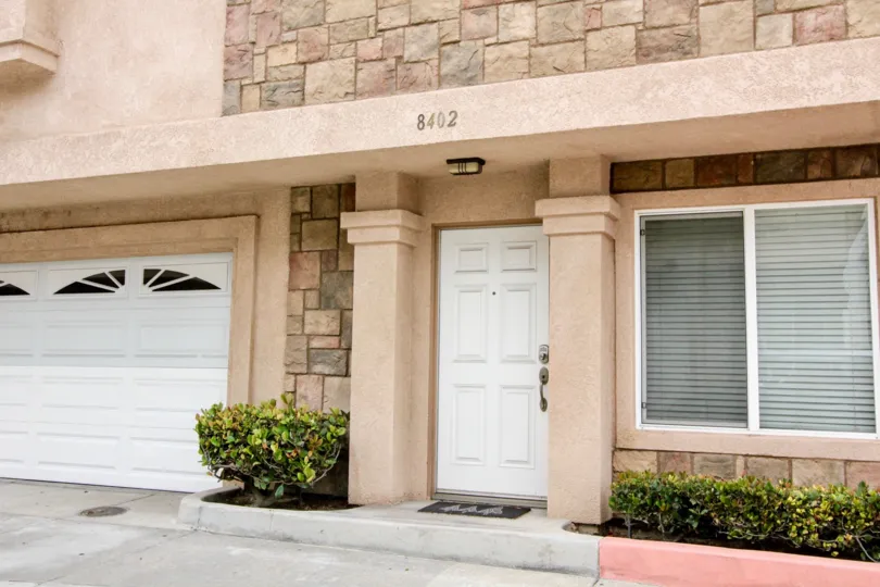 A white color door in the Buena Villa with a house.