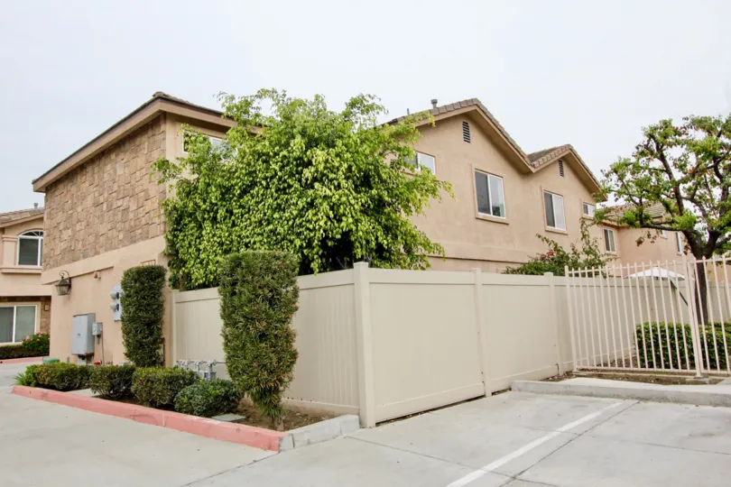 Out side view of a home with garden in Buena Villa TOwnhomes at Buena Park of california