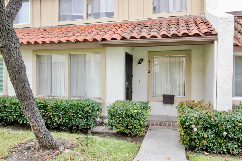 An entranc eof a house in the Casitas California with a window and plants.