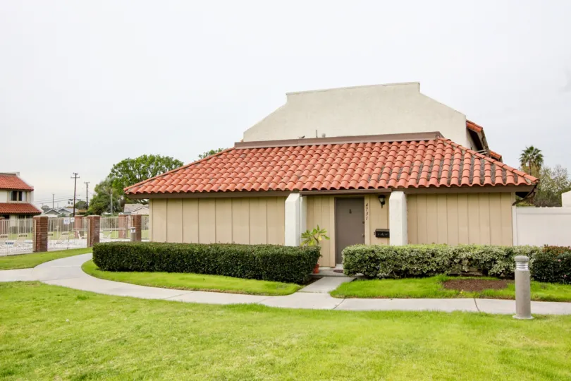 A home in the casitas california surroundings full of plants, lawn and trees
