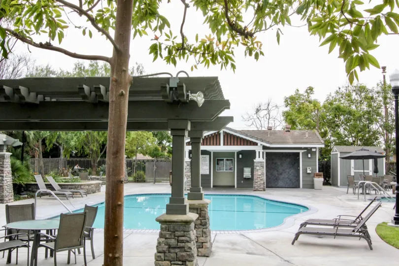 A restaurant in college park with swimming pool and trees