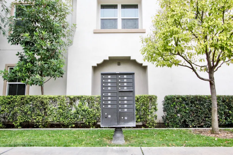 THIS IMAGE SHOWS THE VILLAS ON THE FRONT LAWN, PLANTS, TREES ARE THERE IN BUENA PARK