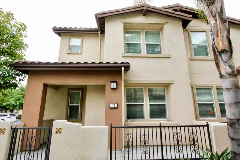 THE 76 FLAT IN THE FOUNDERS WALK WITH THE PLANTS, TREES, GATE