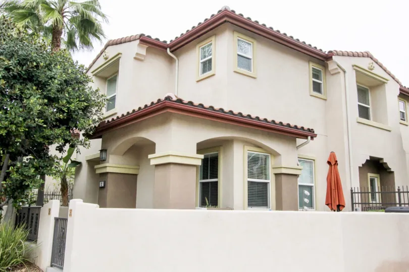 a rainy day in the founders walk with a house that has roofless top and compound walls