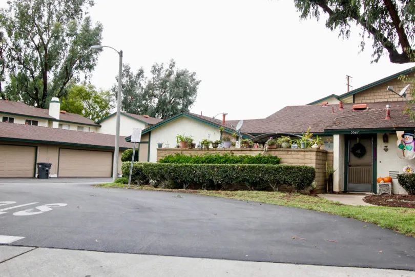 THIS IS THE ENTRANCE WAY TO HOME WITH SMALL PLANTS ON THE RIGHT SIDE, DISHES, NIGHT LAMPS ARE THERE IN BUENA PARK