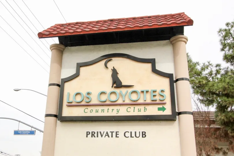 The entrance sign and logo for the Los Coyotes Village