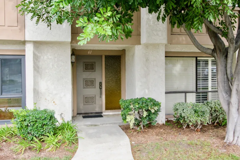 THIS IS THE FRONT VIEW OF THE HOME LOCATED IN BUENA PARK AND SHOWS THE TREES, PLANTS ON THE BOTH SIDE