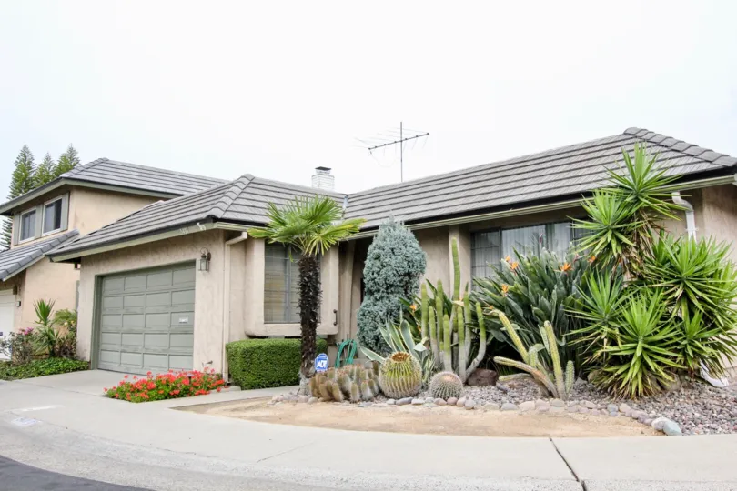 THIS IMAGE SHOWS THE SHED IN BUENA PARK THAT HAVE THE PLANTS LIKE CROTONS, ANTENNA ARE THERE