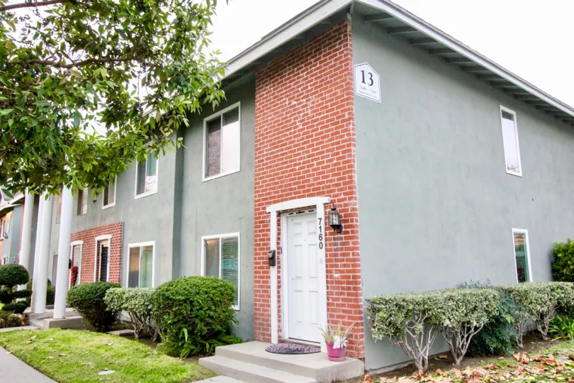THE 7160 APARTMENT IN THE MONTICELLO TOWNHOMES WITH THE PLANTS, TREES, GRASSLAND