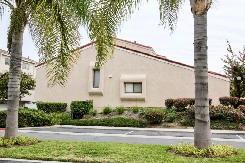 A beautiful home in regency east with full of green plants, lawn and trees