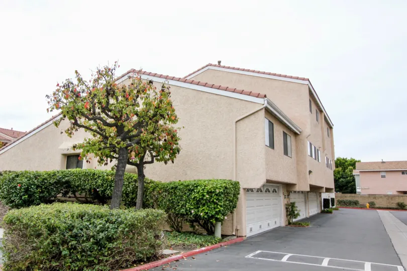 A driveway with a speed bump near a condo garage in Regency East at Buena Park CA