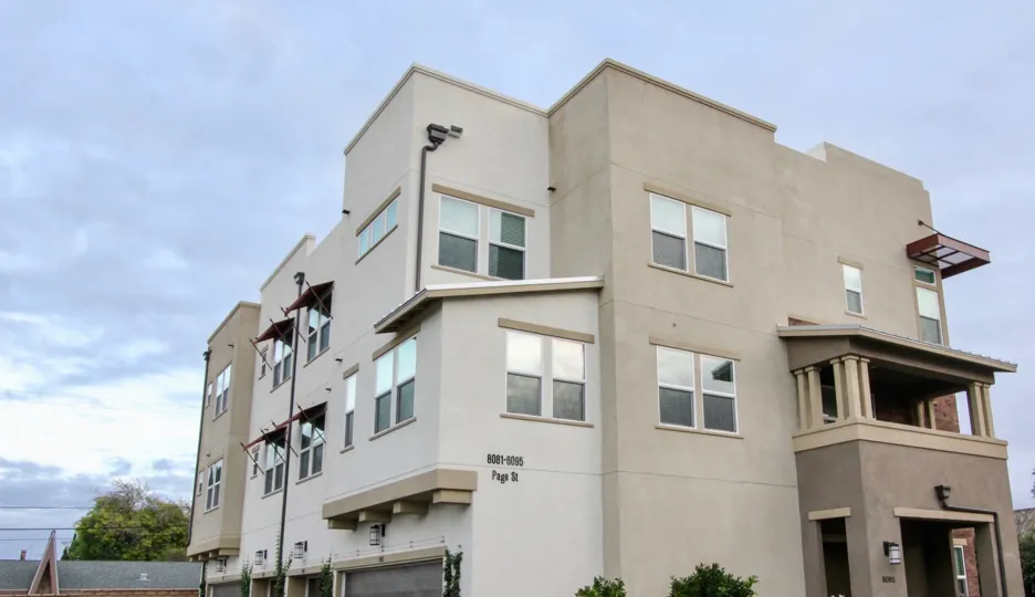 An apartment in The Parker Collection with glass windows.