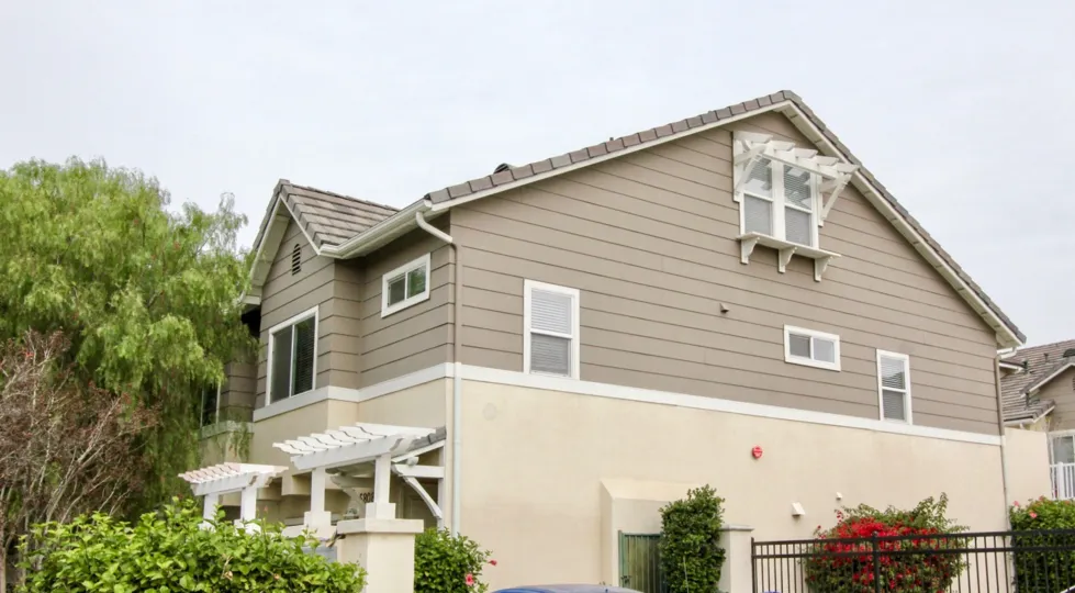 THE SIDE VIEW OF THE VILLA ON THE FRONT LOT OF PLANTS LIKE CROTONS LOCATED IN TRELLIS LANE