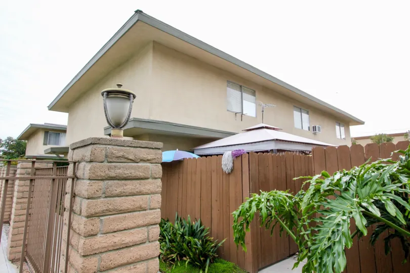 THIS IS THE SIDE VIEW OF THE HOME WITH LIGHT LAMP, SMALL PLANTS ARE THERE LOCATED IN BUENA PARK
