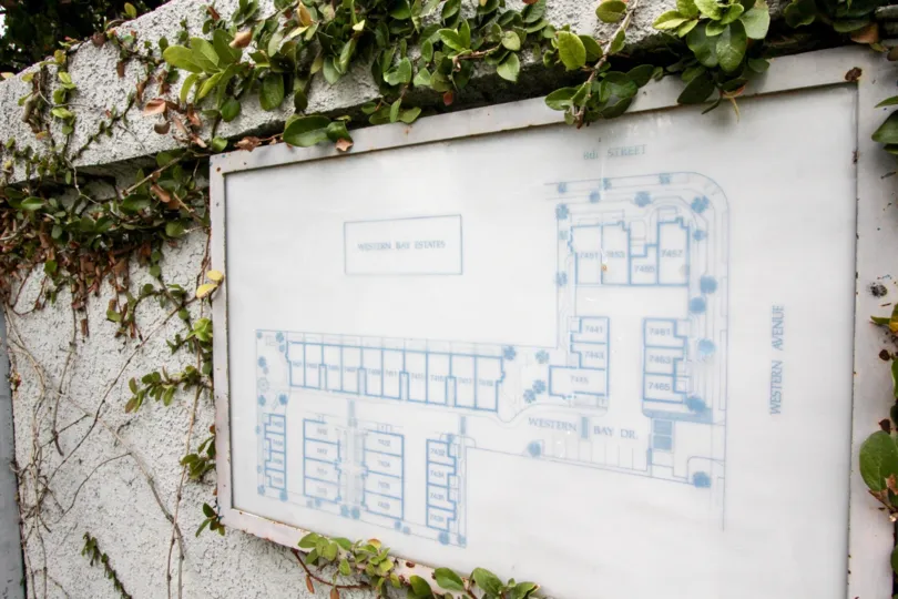 A bright day in the Western Bay Estates with a map on the wall