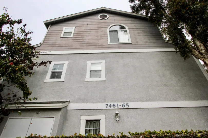 THIS IS FRONT OF THE HOME WITH NUMBER ON THE WALL NEARBY PLANTS TREES ARE THERE IN BUENA PARK