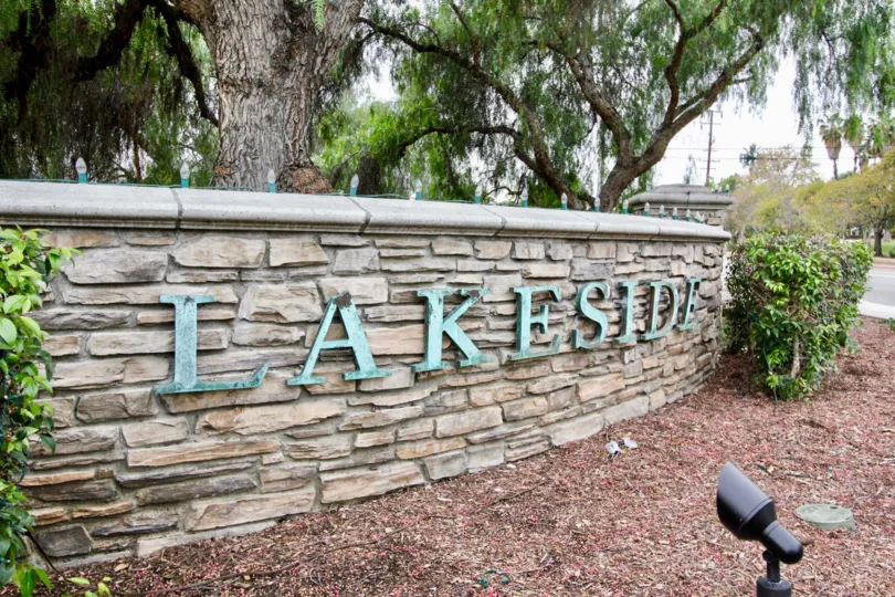 a pleasant day in the westshore villas with a building that has named as lake side and trees around