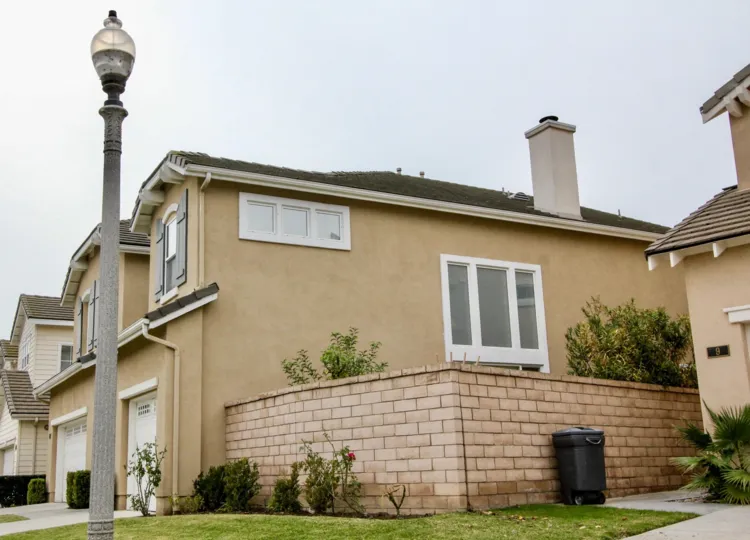 Villa in Westshore Villas has street lamp, dustbin box with plants