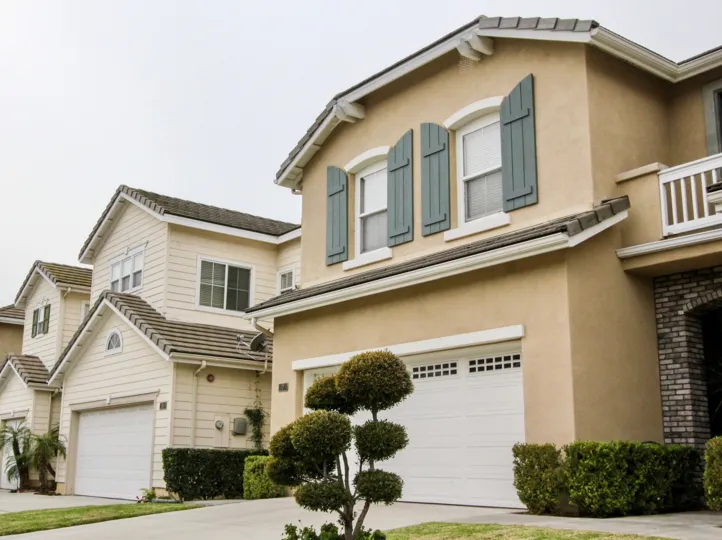 THIS IMAGE REPRESENTS THE VILLAS WITH SHED ON THE FRONT SMALL PLANTS ARE PLANTED IN BUENA PARK CITY