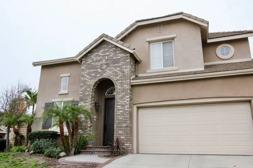THE HOUSE WITH SHED ON THE FRONT LOT OF CROTON PLANTS ARE PLANTED IS LOCATED IN BUENA PARK