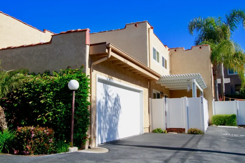 A sunny day in the Alta Mesa is like a villa with lots of trees and plants and also with shed and clean street road.