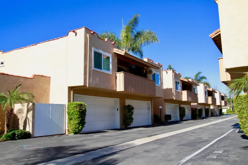 Alta Mesa street with a row of apartments on a sunny day.