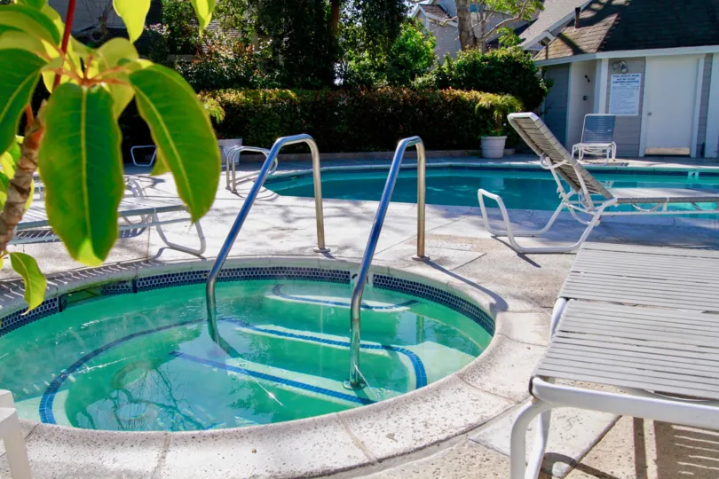 The home with Shubel hung stried outdoor and the houses back proch and front of the swimming pool to unity the building.