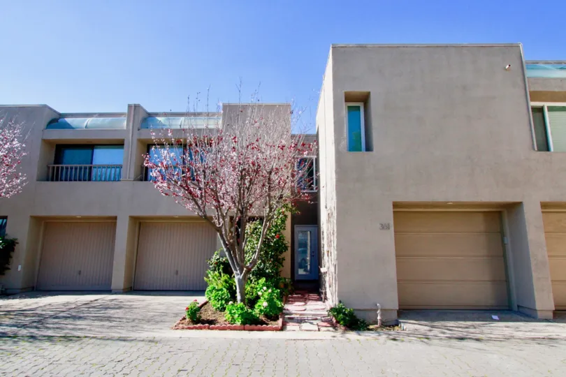 In front of Bay View Terrace community garage doors in Costa Mesa, CA