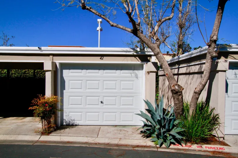 The front individual garage entrances in the community of Brighton Springs in Costa Mesa, California.