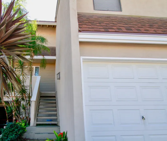 Excellent view of villa with stair case and trees around in Brighton Springs of Costa Mesa