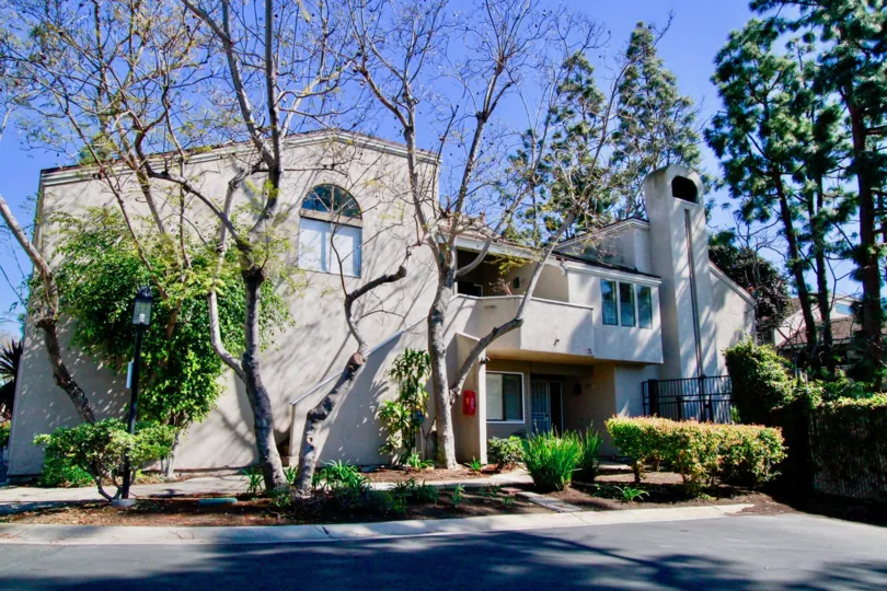 THE HOUSE WITH MORE TREES AND GARDENS PLANTS AND THE SHADOW OF THE TREE AT THE ROAD AND A BALCONY ALSO AVAILABLE AT THE HOUSE.