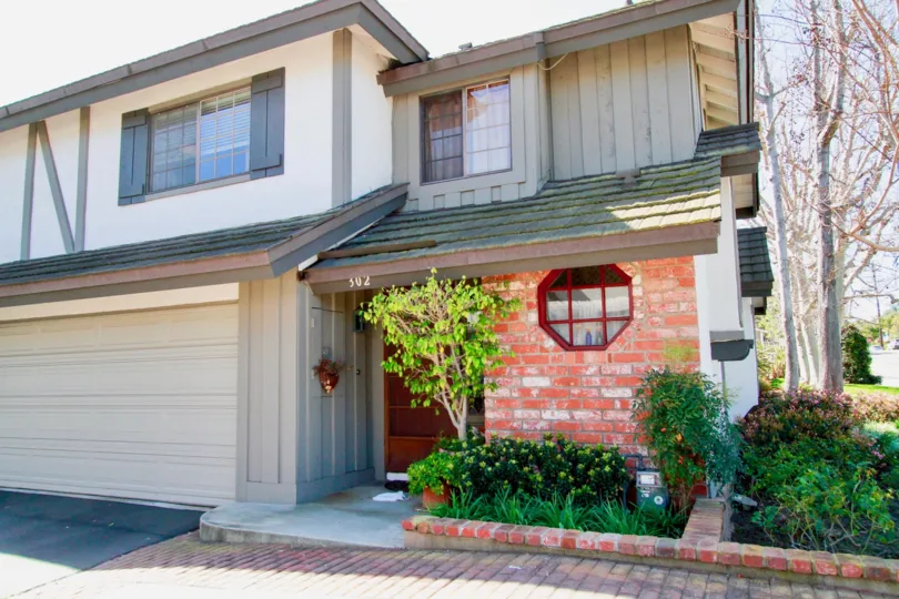 Brittanywoods Costa Mesa California contrast colored bricks design on wall with round window