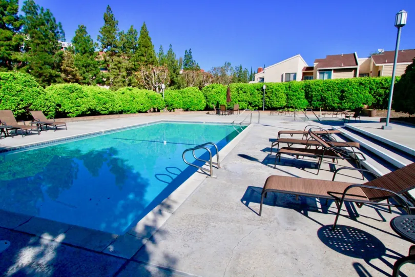 Fabulous swimming pool with sitting place near villas in Brookview of Costa Mesa
