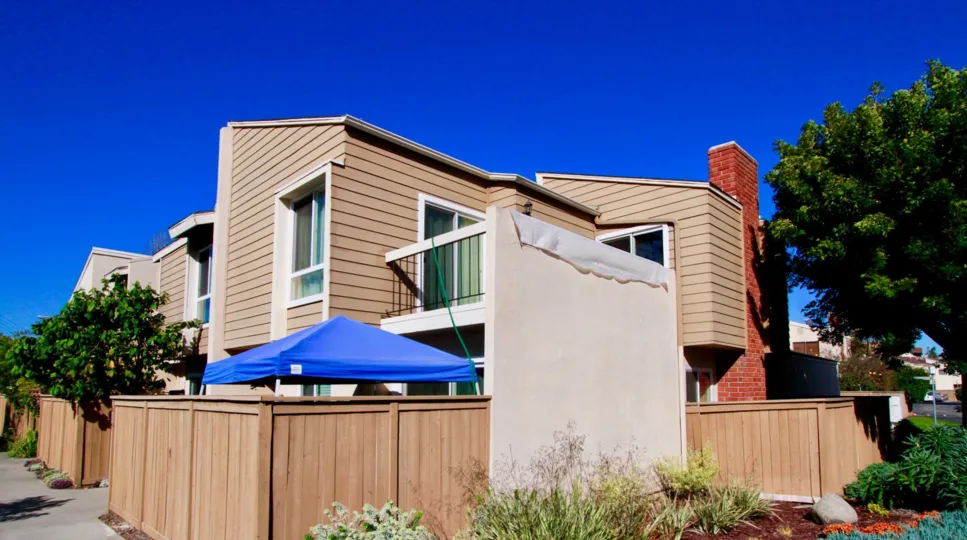 Brookview Costa Mesa California building is biscuts color paint and line apply glass window attached back side tree walk place very need