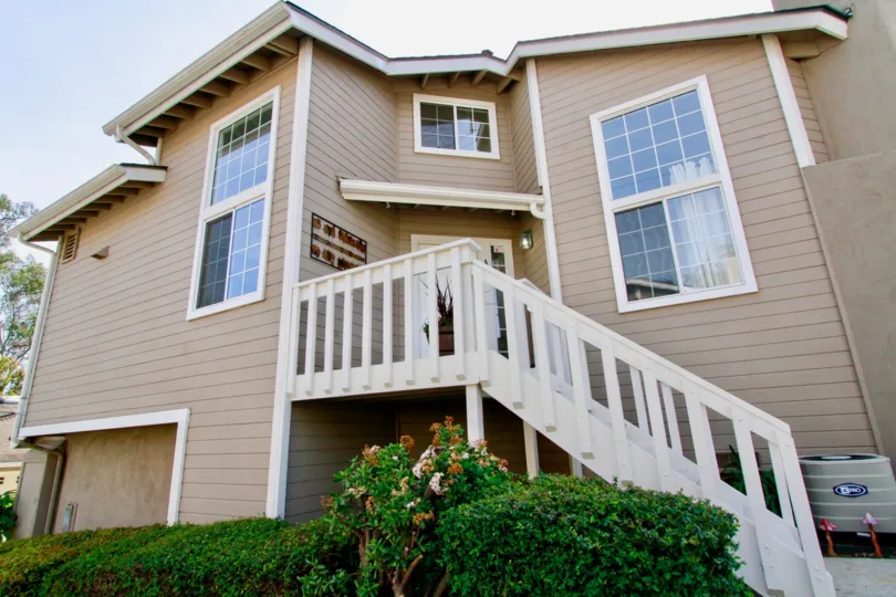 Modern, beige, home, showing garage, picture windows, stairs, Canyon Walk, Costa Mesa, California