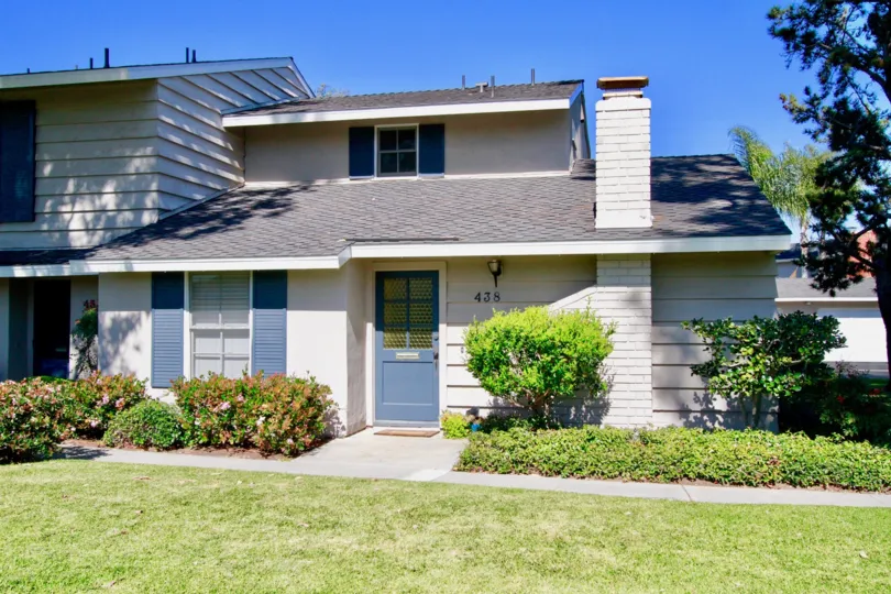 Front door and landscaping at a home in the Cape Series community of Costa Mesa California.