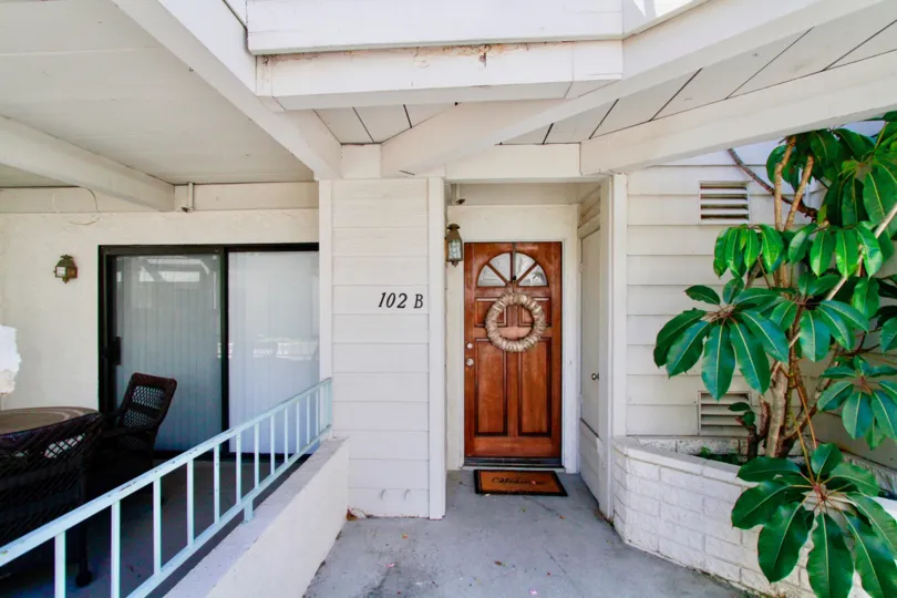 The walkway and front door to a unit at Coral Point, Costa Mesa, California.