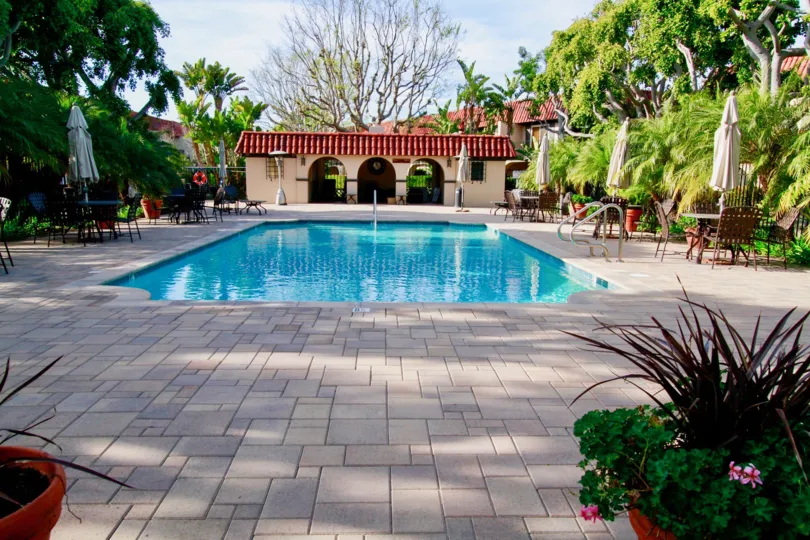 A beautiful day outdoors with a refreshing pool in Country Club Villas community.