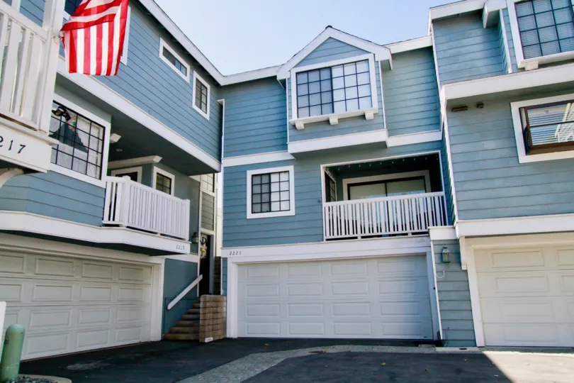Garages and spacious rear balconies of Garden Park Village homes in Costa Mesa California.