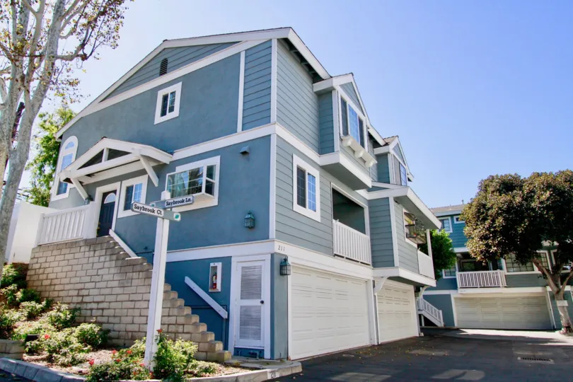 Nice Blue Coloured Villas having trees around in Garden Park Village of Costa Mesa