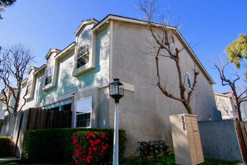 Genoa Cove Costa Mesa California house with leafless tree near that building and light