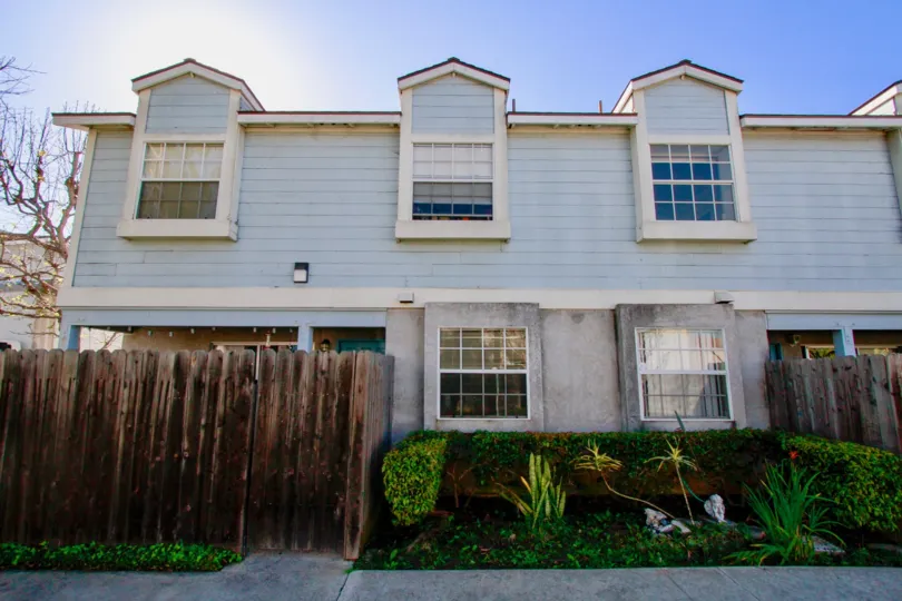 Blue house on a sunny day at the community of Genoa Cove at Costa Mesa California