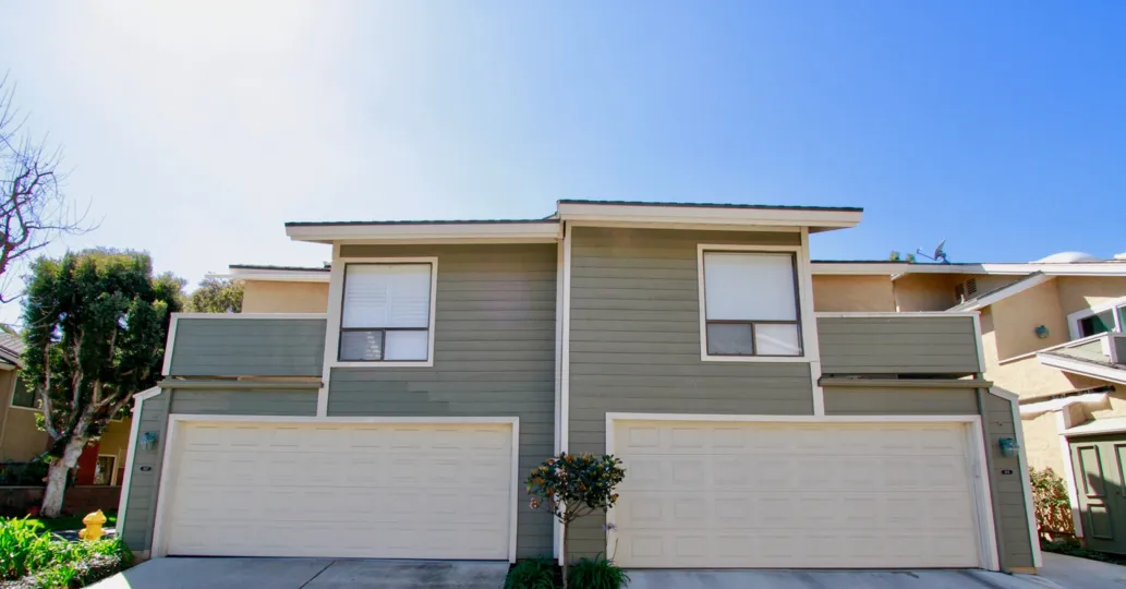 A huge and elegant home in the Laurel Point is the residential area with nearby houses, sheds, trees, plants and also with clean streets.
