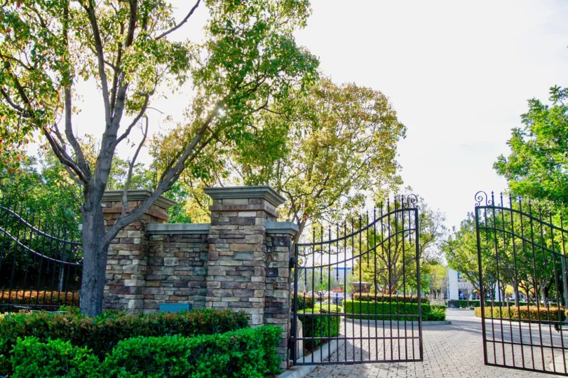 A sunny day in the Laurels at Providence Ranch and also with children play ground and Lots of green trees with front Gate.