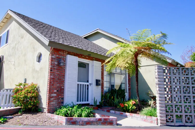 Quaint front entrance and garden of Monticello home in Costa Mesa California
