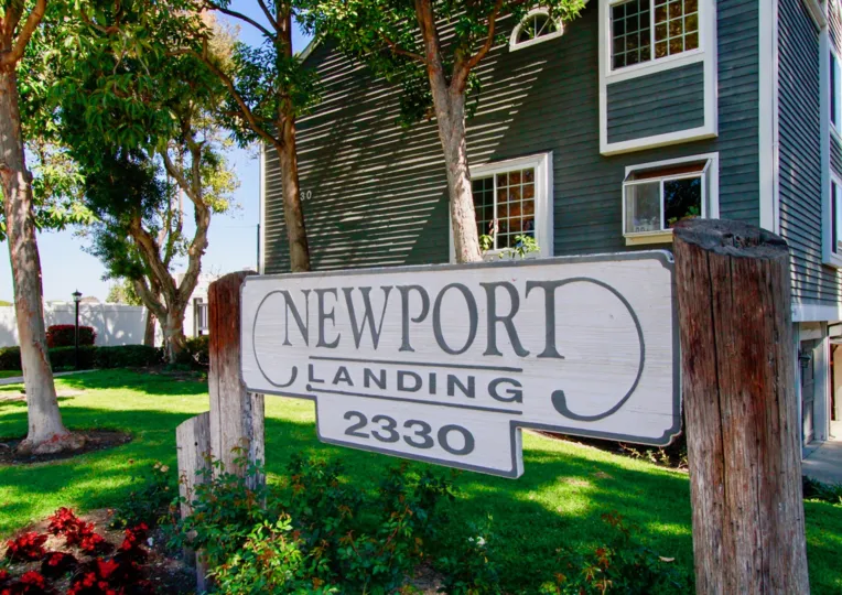 THE BUILDING WITH A FRONT SIGN THAT REPRESENT THE NEWPORT LANDING AND SOME TREES ALSO AVAILABLE.