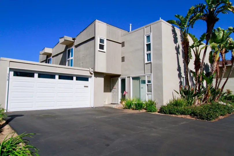 A home in the Newport Riviera is the very beautiful with residential area and in that home having shed, trees, plant.